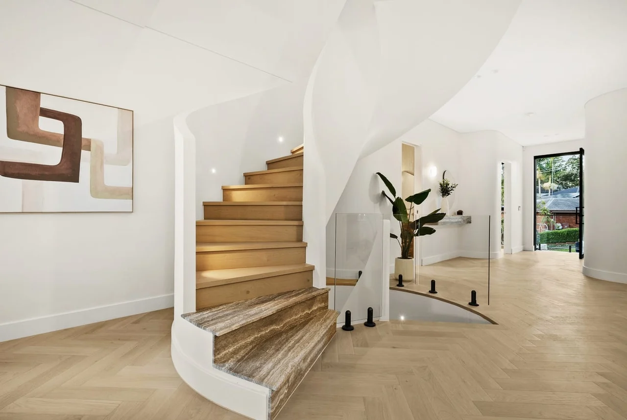 Curved timber staircase and stone base at Deborah, Eastwood